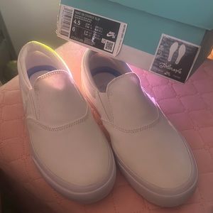Nike Size 6 in women (4.5 in men’s) brand new canvas slip-on white shoes
